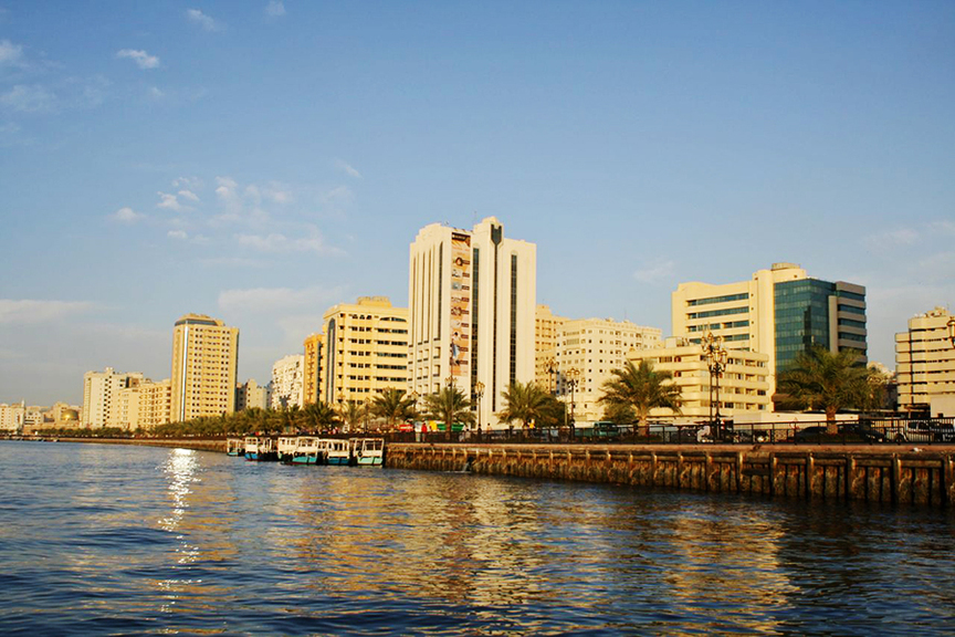 Early evening on the waterfront along Sharjah’s Heritage and Arts area. Near the clustered boats was a barely discernible flag, by BYRON KIM, in a pitch-perfect imitation of Sharjah-sky blue, an extension of his interest in capturing atmospheric colour. Photo by HG Masters for ArtAsiaPacific.