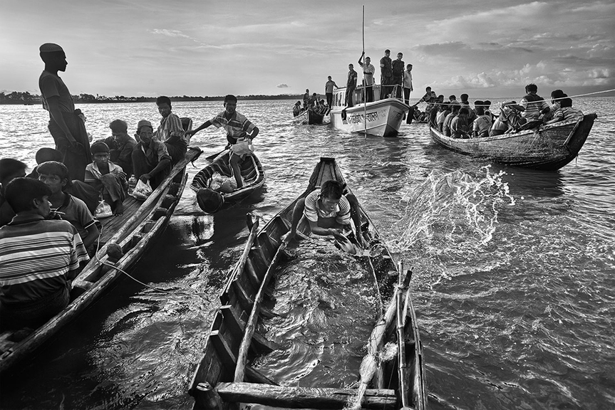 After the June violence in 2012, a large number of refugees started to come to Bangladesh. In mid June, 137 of them were caught by the Border Guards of Bangladesh as they were trying to get into Bangladesh during the Dark Nights. In the next morning, they were pushed back to the sea, using these broken boats. 132 of them died within hours of the push back on the sea as their boats were sunk. Courtesy the artist.