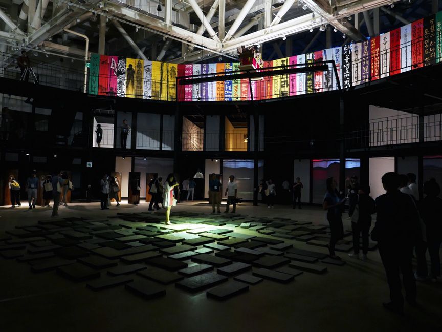 Works by YEO SANG HEE plus banners by YEONKUN KANG titled Between Heaven and Land (1995) from the Gwangju Unification Art Festival, an anti-biennale organized by Minjung and other artists.