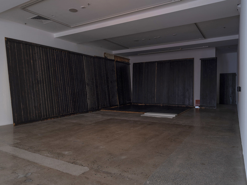 Installation view of DALE HARDING’s Perished in isolation, 2019, cement, charred wood, glass, ocher, plaster, xanthorea resin, dimensions variable, at “Current Iterations,” Institute of Modern Art, Brisbane, 2019.